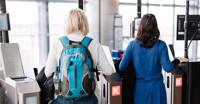 Self-service boarding gates
