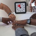 A Unicef team creating a collaborative paper plane. (Unicef)
