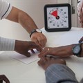 A Unicef team creating a collaborative paper plane.
Photo credit: Unicef