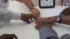 A Unicef team creating a collaborative paper plane.
Photo credit: Unicef