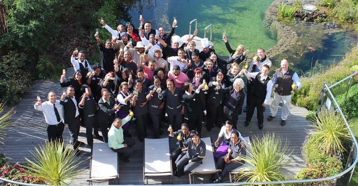 Hotel Verde staff celebrating the good news of FTT accreditation at the eco pool