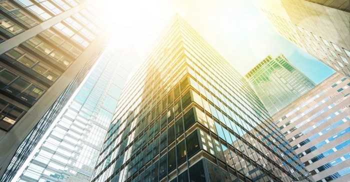 Redefine shares rise despite cut to dividend