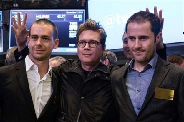 Twitter co-founder Biz Stone, at center in 2013 photo at the New York Stock Exchange debut of the social network, is flanked by co-founders Jack Dorsey, at left, and Ev Williams. Stone is returning to work at Twitter after a six-year hiatus |
