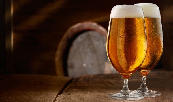 Beer sales and tax revision add fizz to AB InBev