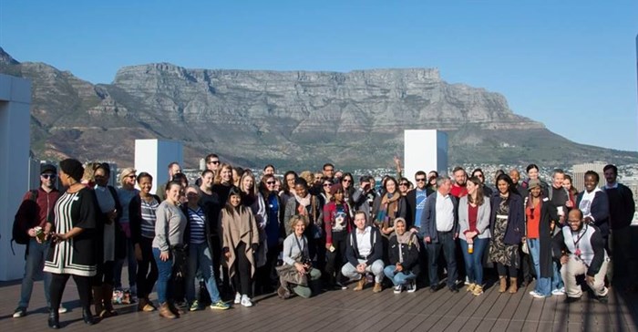 Session attendees on the Nasdak. Image © .