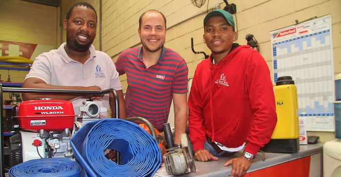 Co-owners of Majozi Brothers Construction Sihle Ndlela (left) and Simphiwe Majozi (right) celebrate the launch of Majozi Bros Tool Hire & Sales with Hire-It Natal's Richard Fraser.