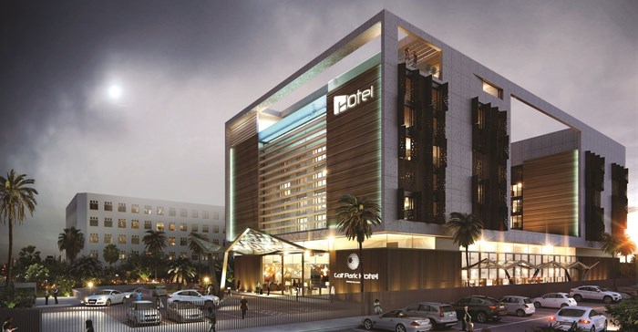 Golf Park Hotel evening view with signage