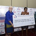 US Ambassador Deborah Malac, Power Africa coordinator Andrew Herscowitz, and Irene Muloni, minister of energy and mineral development, award CEO of CODE Uganda.