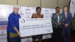 US Ambassador Deborah Malac, Power Africa coordinator Andrew Herscowitz, and Irene Muloni, minister of energy and mineral development, award CEO of CODE Uganda.