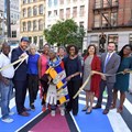 Esther Mahlangu cuts the ribbon to officially open the mural to the public