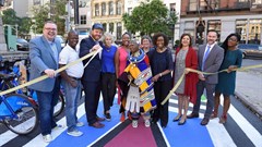 Esther Mahlangu cuts the ribbon to officially open the mural to the public