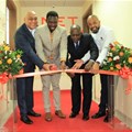 QNET Board Adviser, David Sharma; Deputy Minister for Health, Community Development, Children and Elderly, Hamisi Kigwangalla; Permanent Secretary for Trade, Industry and Investment Adelhelm Meru and QNet Country Representative for Tanzania Benjamin Mariki cut the ribbon during the opening of QNet agent office in Tanzania.