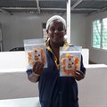 Sweet n Dried founder Mercy Mwende at the processing factory with dried mangoes. (Image Supplied)