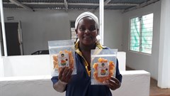 Sweet n Dried founder Mercy Mwende at the processing factory with dried mangoes. (Image Supplied)