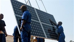 Training workers to properly install solar panels at health clinics in Rwanda provides clean energy and creates green jobs. Photo: Walt Ratterman, Sunepi