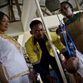 A nurse weighs a baby at a clinic in Accra, Ghana. Photo: Kate Holt/MCSP