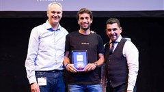 Oradian co-founder Julian Oehrlein on stage at the European FinTech event in Brussels accepting the award for Europe's Most Innovative Banking Software.
