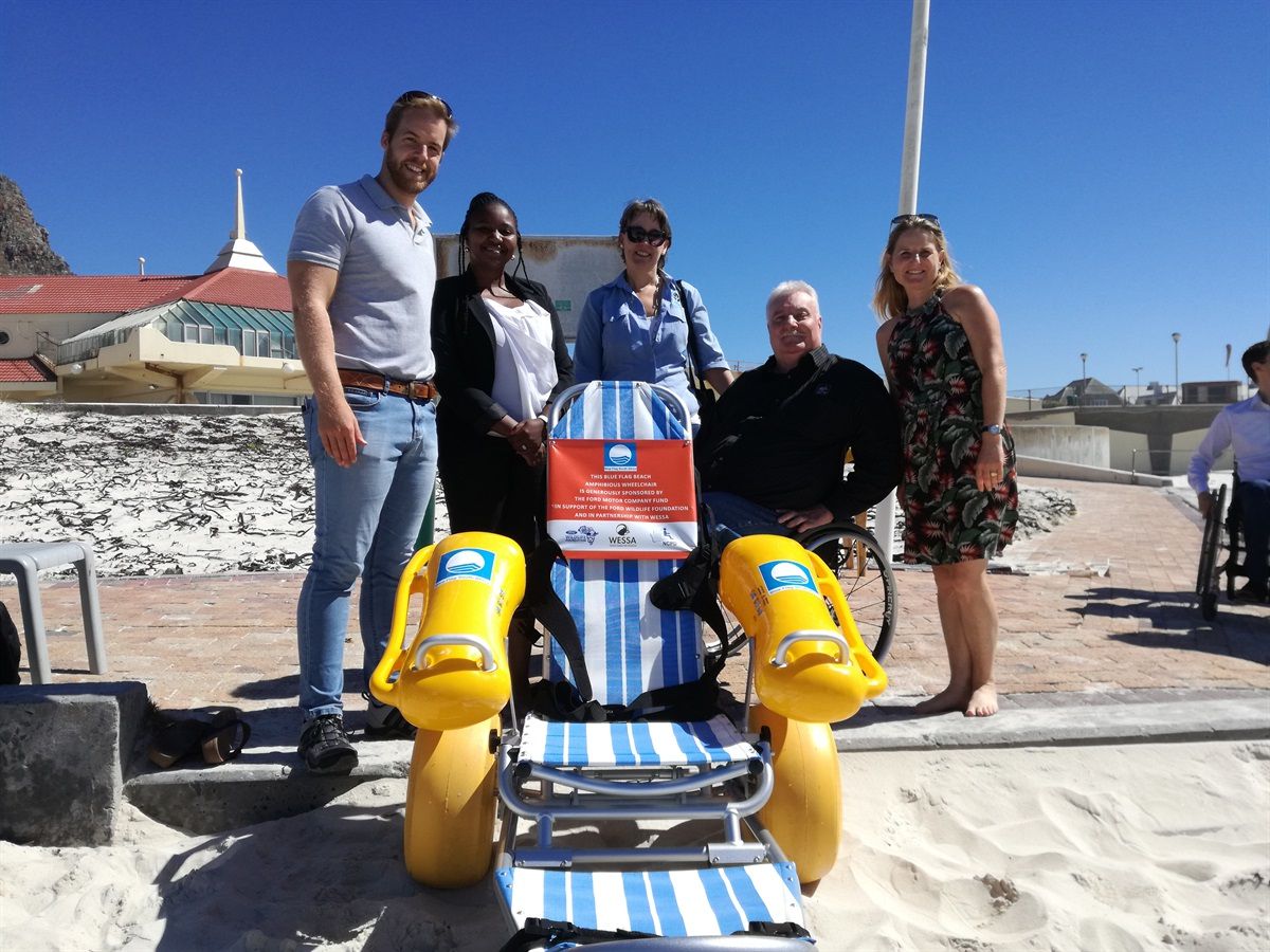 Jakkie Pieters from The National Council for Persons with Physical Disabilities in South Africa (NCPPDSA) accepts their Amphibious Wheelchair on behalf of the Kouga Municipality from Rob Slater (Blue Flag Programme Coordinator), Duduzile Nxele (Ford Motor Company) and Lynda du Plessis (Ford Wildlife Foundation).