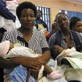 Mothers wait at a local clinic. The city of Johannesburg plans to open 24 hour clinics to alleviate queues. Photo: Reuters stringer