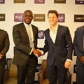 Tigo managing director, Simon Karikari, (second left), and the general manager of Uber East Africa, Loic Amado, shake hands after announcing the partnership between Tigo and Uber Tanzania in Dar es Salaam. Others are: Uber country manager, Alfred Msemo and Tigo’s head of mobile financial services, Hussein Sayed. Source: Tigo.