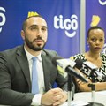 Tigo Tanzania's chief officer for mobile financial services, Hussein Sayed (left), briefs journalists on the GSMA Mobile Money Certification. Flanking him is Tigo's corporate communications manager, Woinde Shisael (right).