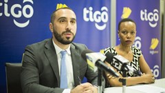 Tigo Tanzania's chief officer for mobile financial services, Hussein Sayed (left), briefs journalists on the GSMA Mobile Money Certification. Flanking him is Tigo's corporate communications manager, Woinde Shisael (right).