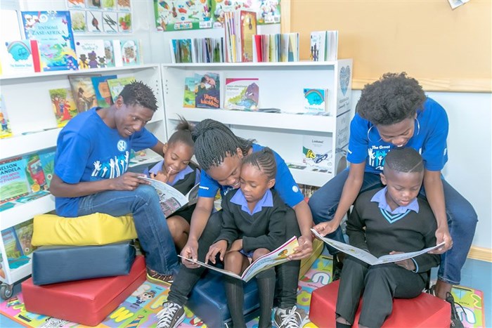 (Left to right) Reading right: VW for Good volunteer Thembisile Matase Zendile with learner Mpho Tau, volunteer Sibongile Mbedzi with Emihle Makasi and Sinazo Qolohle with learner Buhle Ntshenge. This literacy centre is based at Mngunube Primary School, KwaNobuhle, Uitenhage.