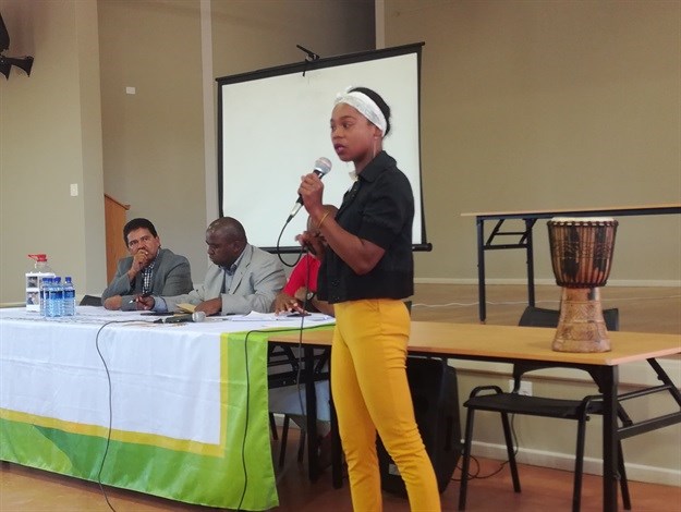 Chandre Cloete told South African Human Rights commissioner Chris Nissen (left) and deputy minister Mcebisi Skwatsha how the eviction of her family from the farm where they lived had changed her life. Photo: Barbara Maregele