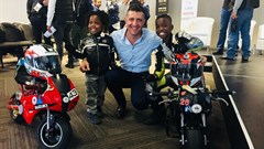 Passion starts young! Two bikers ride in to the venue to mark the end of the Conference. (l-r) Amohelang Phiri (four years old), AutoTrader CEO George Mienie, Oratilwe Phiri (nine years old). Photos published with consent from mother Tsilane Phiri.