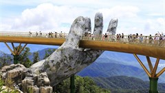 Giant hands lift new Vietnamese floating bridge