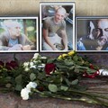 Flowers and photos of Aleksandr Rastorguyev, Kirill Radchenko, and Orkhan Dzhemal, are left at the journalist union building in Moscow. The Russian journalists were killed while on assignment in the Central African Republic. Credit: AP/Pavel Golovkin/CPJ.