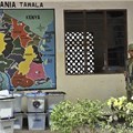 Tanzanian police stand guard outside a vote counting center at a school in Dar es Salaam, Tanzania, on October 28, 2015. Credit: AP Photo/Khalfan Said/CPJ.