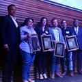 The 2018 Standard Bank Sikuvile Journalism Awards' investigative journalism and story of the year winners on stage.