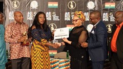 Matlou Tsotetsi, director, Brand Communication, presenting the certificate of AFRIMA Host Country to Ghana Minister Catherine Afeku, Ministry of Tourism, Arts & Culture.