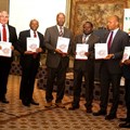 Unveiling the Zimbabwe Economic Report: (L-R) Malcolm Pautz, G:ENESIS Analytics; Damoni Kitabire country manager COZW; Zvinechimure R. Churu, principal director Ministry of Finance and Economic Development; Walter Odero, principal country economist COZW; Ferdinand Bakoup, Ag. director ECCE; and George A. Kararach, lead economist RDGS.