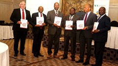 Unveiling the Zimbabwe Economic Report: (L-R) Malcolm Pautz, G:ENESIS Analytics; Damoni Kitabire country manager COZW; Zvinechimure R. Churu, principal director Ministry of Finance and Economic Development; Walter Odero, principal country economist COZW; Ferdinand Bakoup, Ag. director ECCE; and George A. Kararach, lead economist RDGS.