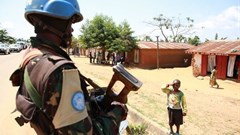 A Congolese child saluting a MONUSCO peacekeeper. Abel Kavanagh/Wikimedia Commons, CC BY-SA