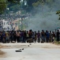 Protesters block the main route to Zimbabwe's capital Harare from Epworth township on January 14, 2019, after the government more than doubled the price of fuel. On January 15, CPJ joined more than 20 rights organizations and the #KeepItOn Coalition to call for authorities in Zimbabwe to restore internet and social media services. Credit: CPJ/AFP/Jekesai Njikizana.