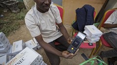 An electoral worker prepares identity card and biometric verification readers, at the offices of the Independent National Electoral Commission in Kano, northern Nigeria, on February 14, 2019. CPJ joined a call for Nigeria to ensure that internet and social media services remain connected during the upcoming elections. Credit: CPJ/AP Photo/Ben Curtis.