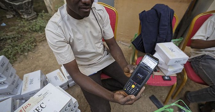 An electoral worker prepares identity card and biometric verification readers, at the offices of the Independent National Electoral Commission in Kano, northern Nigeria, on February 14, 2019. CPJ joined a call for Nigeria to ensure that internet and social media services remain connected during the upcoming elections. Credit: CPJ/AP Photo/Ben Curtis.