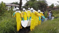 Health workers in Liberia at the height of the 2014-2016 Ebola outbreak. Ahmed Jallanzo/EPA