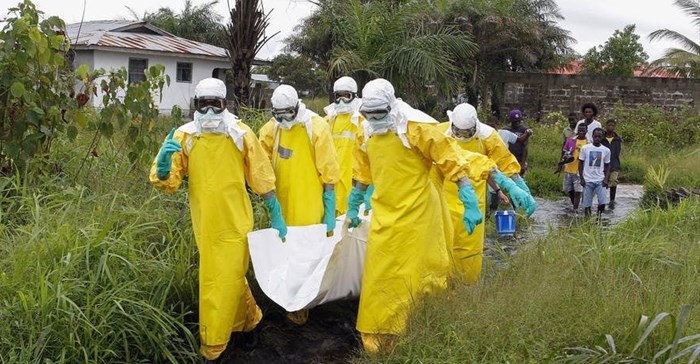 Health workers in Liberia at the height of the 2014-2016 Ebola outbreak. Ahmed Jallanzo/EPA