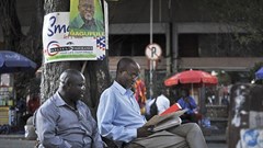 Tanzanians sit next to a tree in Dar es Salaam in 2015. Tanzanian authorities this week imposed a temporary ban on The Citizen over its reporting. Credit: CPJ/AP/Khalfan Said.