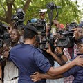 Congolese police officers hold back members of the media in Kinshasa, Democratic Republic of Congo, on January 12, 2019. Journalist Steve Mwanyo Iwewe was recently fined and sentenced to one year in jail for insulting the governor of Équateur province. Credit: CPJ/Jerome Delay/AP.
