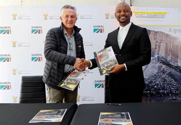 Pilot Crushtec CEO Sandro Scherf and Sanral CEO Skhumbuzo Macozoma shake hands following the MoU signing ceremony at Pilot Crushtec in Boksburg.