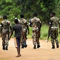 Military police patrol the streets of Gorongosa, in central Mozambique, on November 19, 2013. A radio journalist in Mozambique has been held in pretrial detention since January, 2019. Credit: CPJ/Reuters/Grant Lee Neuenburg.