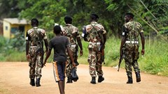 Military police patrol the streets of Gorongosa, in central Mozambique, on November 19, 2013. A radio journalist in Mozambique has been held in pretrial detention since January, 2019. Credit: CPJ/Reuters/Grant Lee Neuenburg.