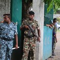 Soldiers stand guard on April 2, 2019, in Moroni, the capital of the Comoros. Journalists have been detained and newspapers have been disrupted surrounding the country's recent presidential election. Credit: CPJ/AFP/Youssouf Ibrahim.