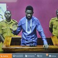 Ugandan pop star and opposition figure Bobi Wine appears for his bail application via a video link from prison, on a television screen in a court in Kampala, Uganda, on May 2, 2019. Uganda's media regulator suspended staff from 13 broadcast outlets for covering his arrest. Credit: CPJ/AP/Ronald Kabuubi.