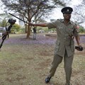 A Kenyan journalist has an altercation with a police officer. EPA/Dai Kurokawa